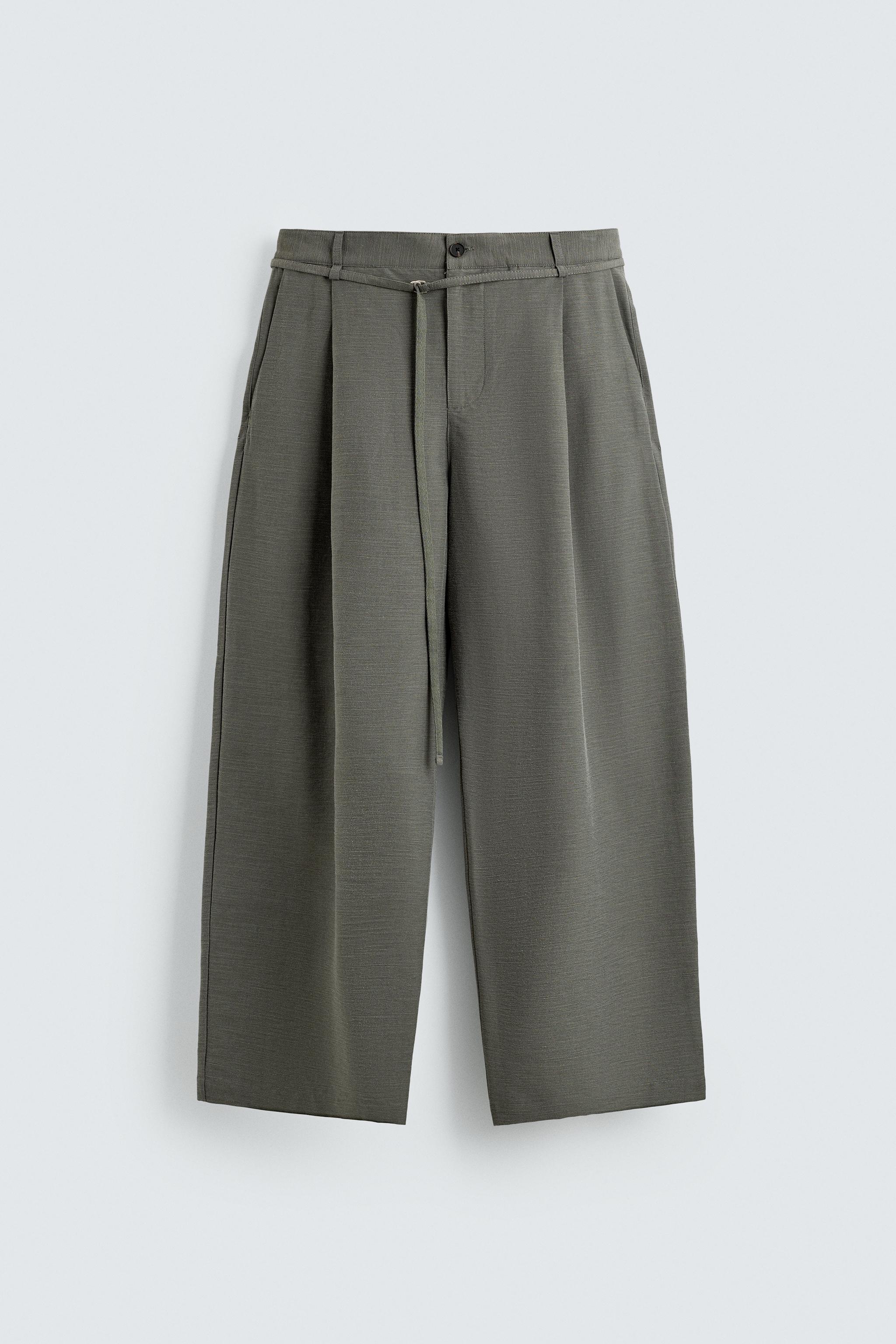BALLOON FIT PLEATED BELTED PANTS